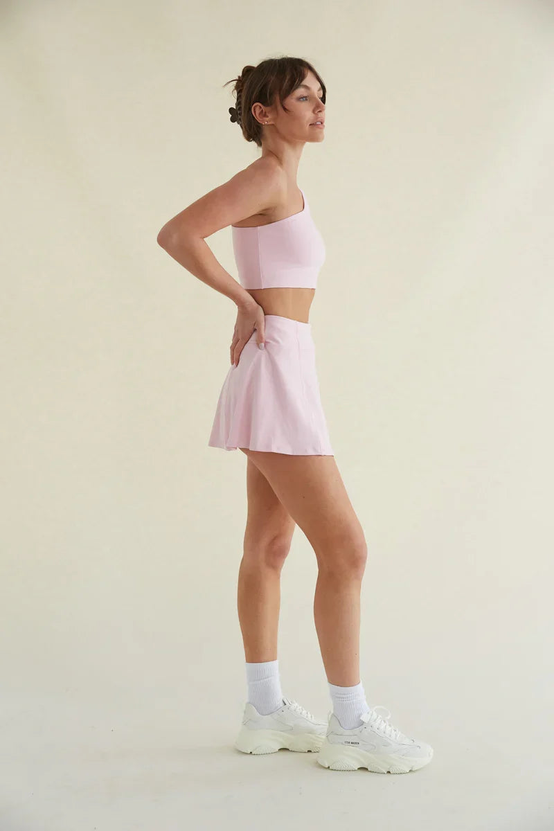 Avery Smoothing Flare Tennis Skort in Pink